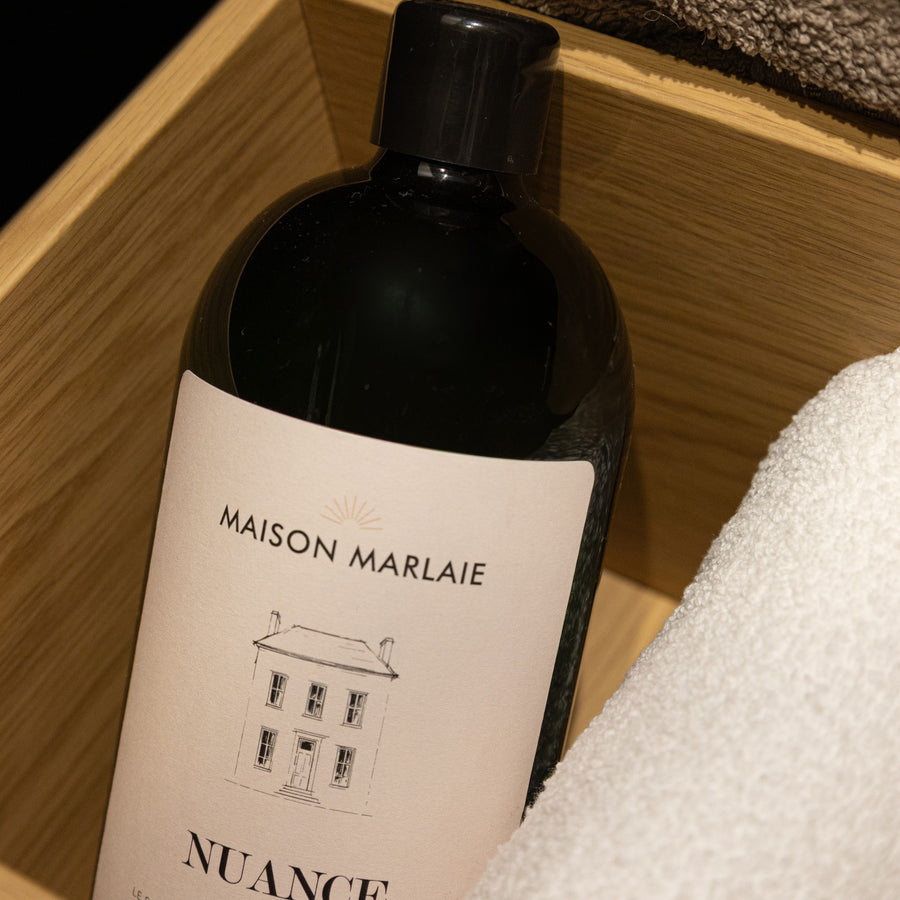 Maison Marlaie NUANCE bottle in a wooden tray with a towel
