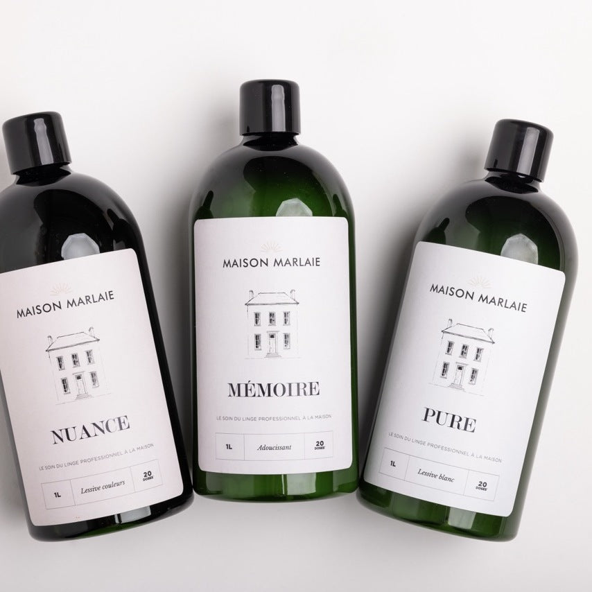 Les trois flacons Maison Marlaie, NUANCE, MÉMOIRE et PURE, posés à plat